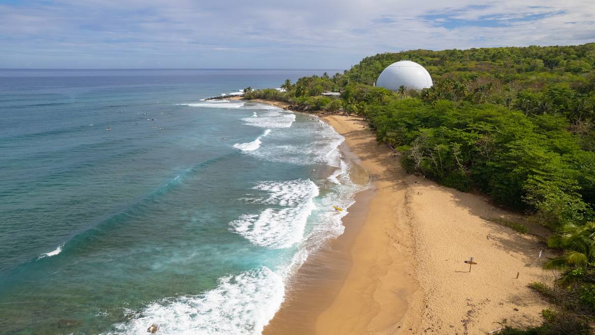 Domes Beach in Rincon Puerto Rico with waves and lighthouse
