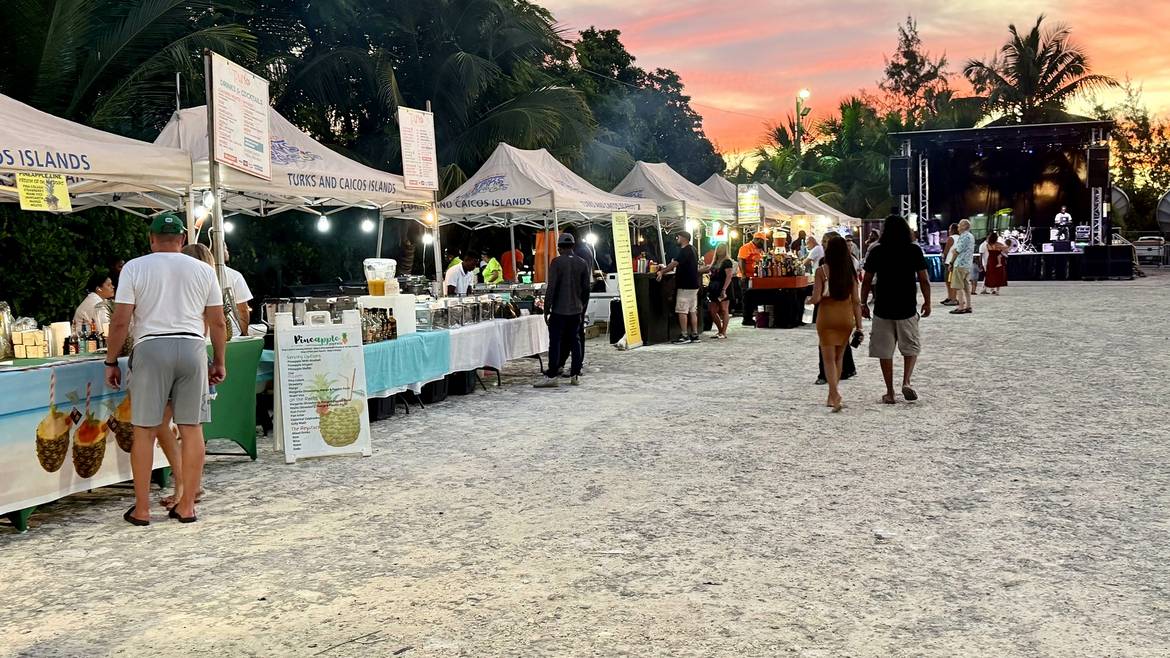 Food stalls and a live music stage at sunset at The Fish Fry in The Bight, Providenciales