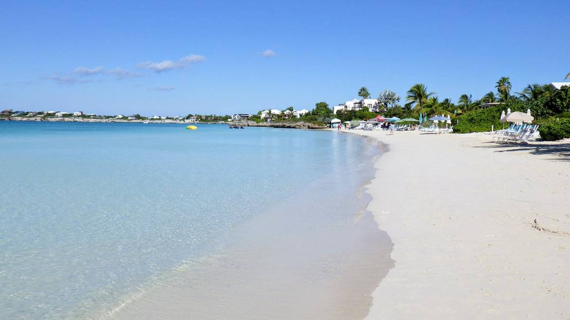 White sand curve and calm water at Sapodilla Bay Beach in Providenciales
