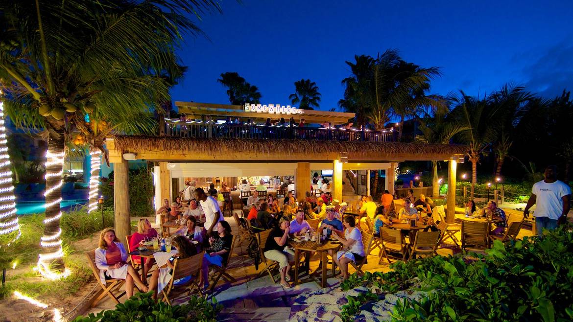 Somewhere Café and Lounge busy at dusk on the beach at Coral Gardens