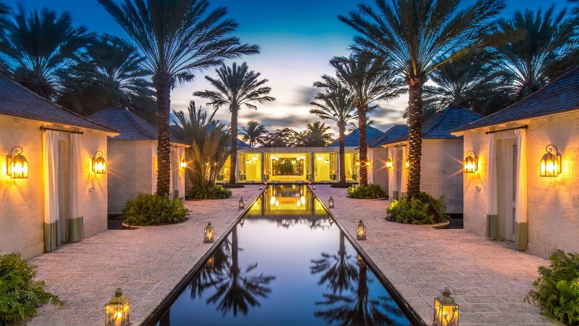 Reflecting pool and treatment cottages at The Spa at The Palms in Providenciales