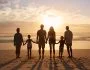 multigeneration family travel on beach
