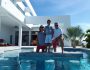 alt="A family in front of Turks and Caicos villa rentals