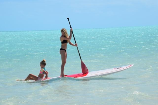 Kids paddle surfing on Turks and Caicos 